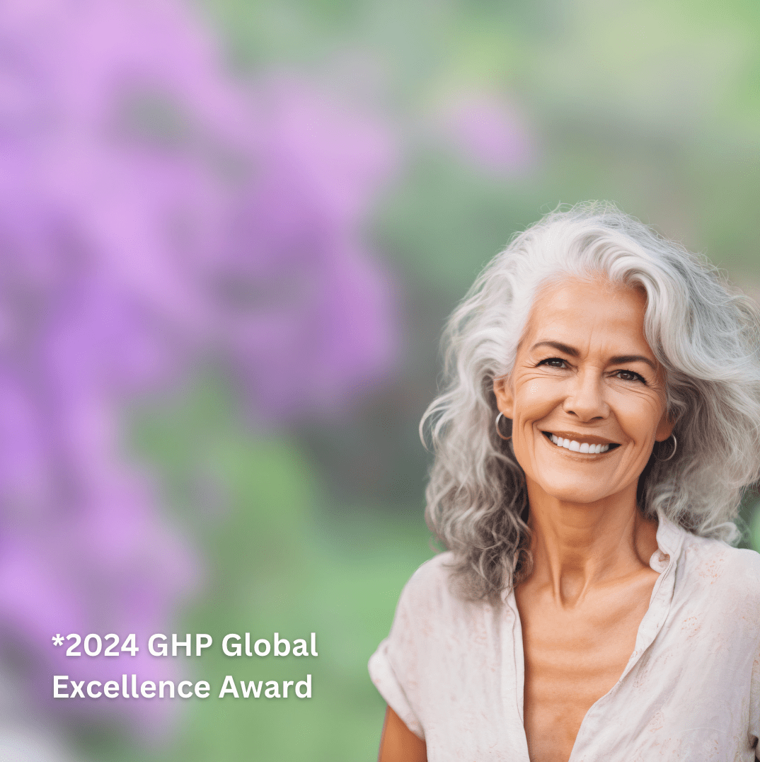 Mature woman in natural outdoor setting with Reluminate Beauty – celebrating natural skincare, confidence, and age-embracing beaut